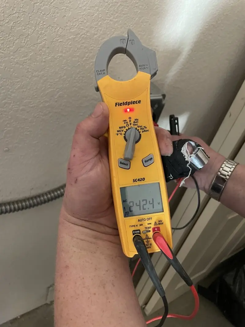 Voltage testing with clamp meter during Recessed Lighting Installation in Anthem